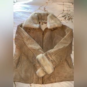 Tan, thick, coat with fur around neck and sleeve cuffs. Great condition.